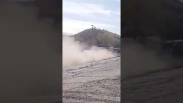 Trophy truck drifting to jump
